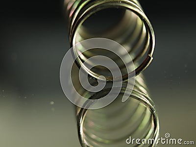 Metal spring round helical spiral reflection elastic Stock Photo