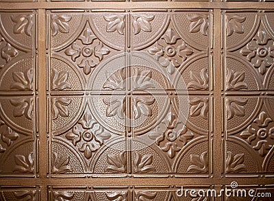 Metal squared design pattern ceiling tile painted brown Stock Photo