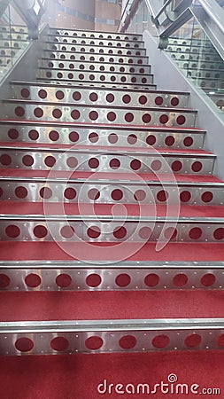 metal staircase with red carpet, theater architecture, interior object Stock Photo