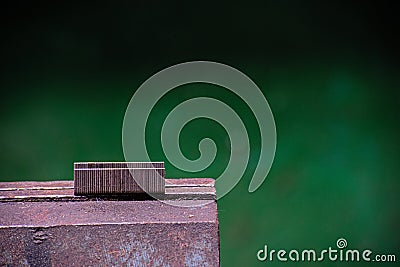 Metal staple lie on a vice Stock Photo