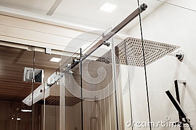 Metal structure of the upper fasteners and rollers for the sliding glass door in the shower Stock Photo