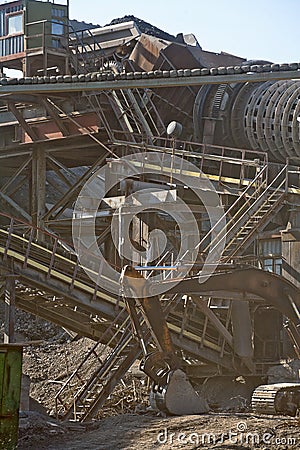 Metal structure and working excavator Stock Photo
