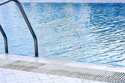 Metal swimming pool stairs Stock Photo