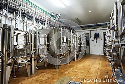 Metal tanks for aging wine at winery Stock Photo