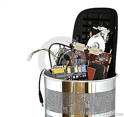 Metal trash can containing computer waste Stock Photo