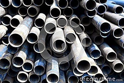 Metal Tubes Stacked in Row Pattern Stock Photo