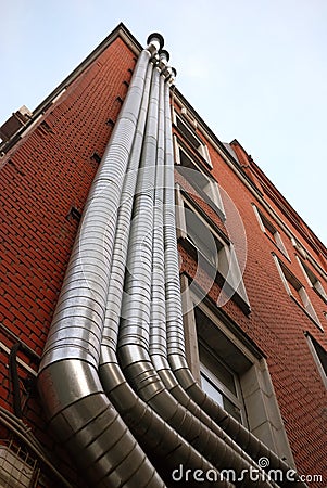 Metal tubes on the wall Stock Photo