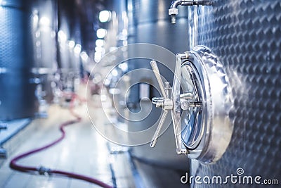 Metal vats for fermentation. Wine factory. Steel barrels in winery. Stock Photo