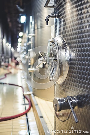Metal vats for fermentation. Wine factory. Steel barrels in winery. Stock Photo