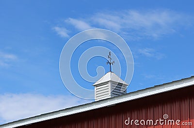 Metal weathervane decorates the roof Stock Photo