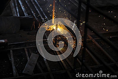 Metal welding. Sparks from electric heating. Iron, materials.Artistic welding sparks light, industrial background Stock Photo