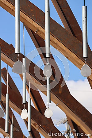 Metal wind chime sculpture against sky, triple-crossed close-up Stock Photo