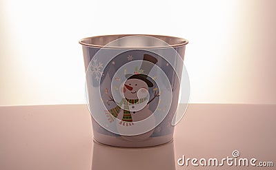 Metal zink Christmas buckets snowman blue background Stock Photo
