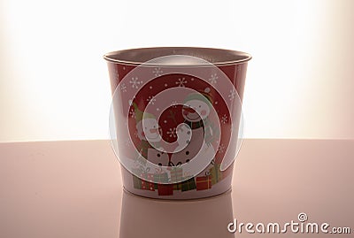 Metal zink Christmas buckets snowmans red background Stock Photo