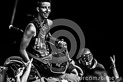 Metalhead in wheelchair during a crowdsurfing at a metal concert Editorial Stock Photo