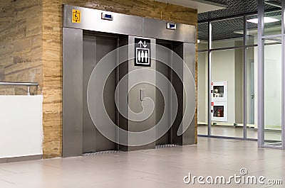 Metalic lift doors in an airport Stock Photo