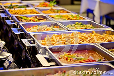 A Groups of Metallic Banquet Buffet Meal on Trays Stock Photo