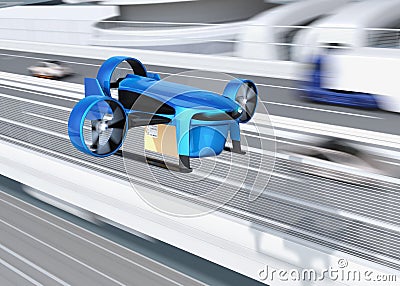 Metallic blue VTOL drone with delivery packages flying beside highway bridge Stock Photo