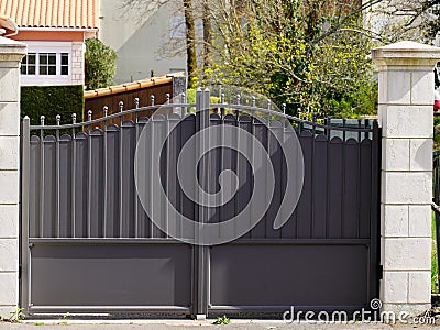 Metallic classic black steel high home metal aluminum house gate Stock Photo