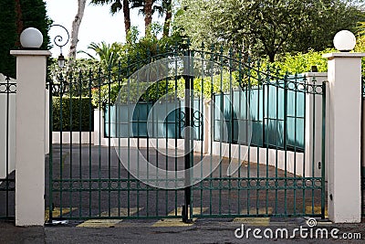 Metallic classic portal home iron classical green black steel vintage metal steel house gate Stock Photo