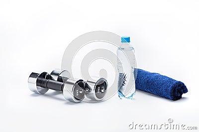 Metallic dumbbells, towel and bottle with water isolated on white Stock Photo