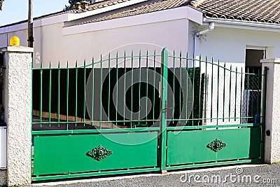 Metallic high door classic portal home iron classical green steel vintage metal steel house gate Stock Photo