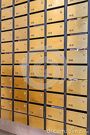 Metallic letter mailbox array at condominium entrance hall Stock Photo