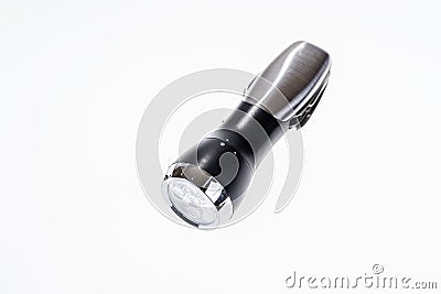 Metallic portable LED flashlight isolated on white Stock Photo