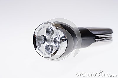 Metallic portable LED flashlight isolated on white Stock Photo