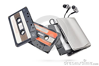 Metallic portable player with earbuds and cassette tape isolated Stock Photo