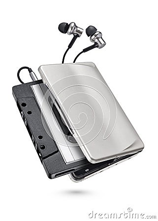 Metallic portable player with earbuds and cassette tape isolated Stock Photo