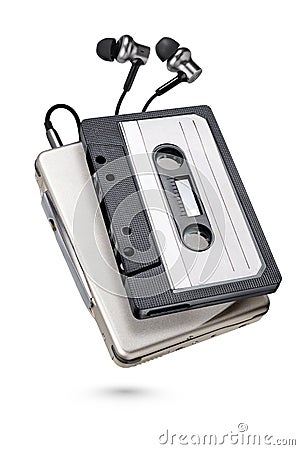 Metallic portable player with earbuds and cassette tape isolated Stock Photo