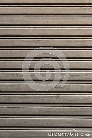 Metallic roll up door. Old Steel rolling shutter background. Stock Photo