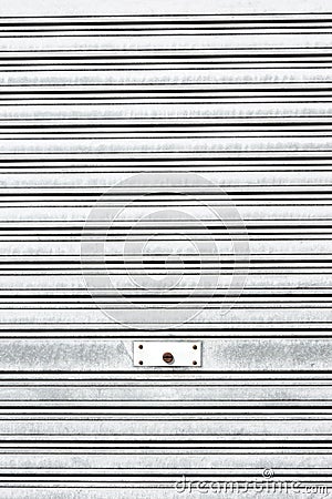 Metallic roller shutter with door lock Stock Photo