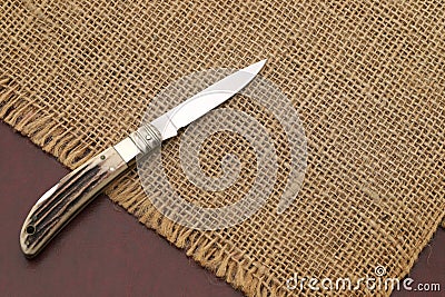 Metallic small folding knife Stock Photo