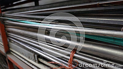 Metallic tubes stacked together Stock Photo