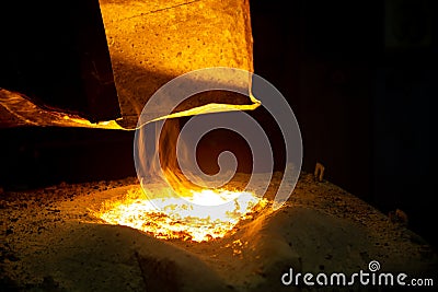 Metallurgical furnace with exhaust hood and melting metal with slag and vapor Stock Photo
