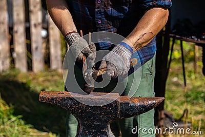 Metalwork artisan at culture festival Stock Photo