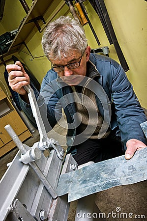 Metalworker and guillotine worker man Stock Photo