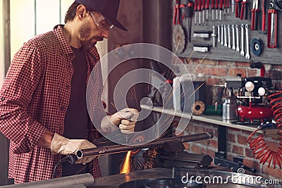 Metalworker working in an engineering workshop Stock Photo