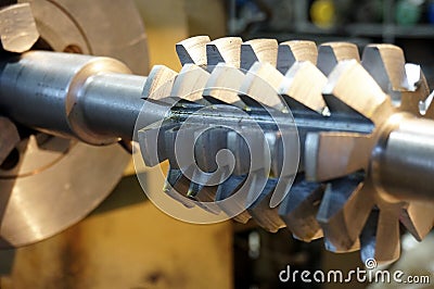 Metalworking industry. rapid steel hobbing cutter with coating for cog wheels gears machining on factory Stock Photo