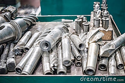 A collection of metalworking tools and accessories displayed in a workshop, showcasing various implement types for precise Stock Photo