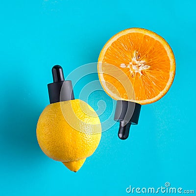 Metaphor, bottle with serum, oil in citrus, orange, lemon. The concept of vitamin C in cosmetics and aromatherapy Stock Photo