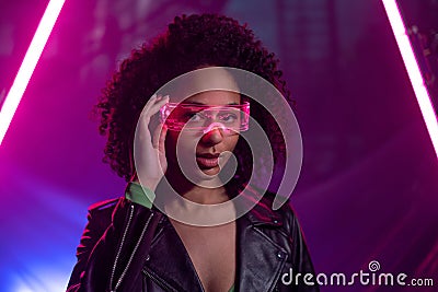 Metaverse digital cyber world technology, woman with virtual reality VR goggles playing augmented reality game Stock Photo