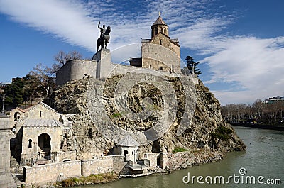 Metekhi church and King Vakhtang Gorgasali in Tbilisi,Georgia Stock Photo