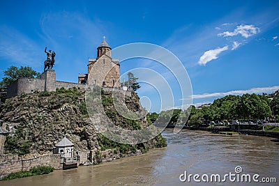 Metekhi church and King Vakhtang Gorgasali in Tbilisi, Georgia Stock Photo