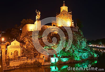 Metekhi orthodox church and Vakhtang Gorgasali statue in Tbilisi georgia Stock Photo