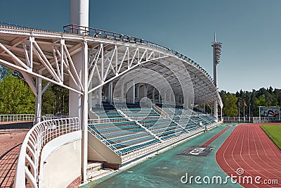 Meteor Stadium, empty rows of seats under canopy and red running tracks, landmark: Zhukovsky Editorial Stock Photo