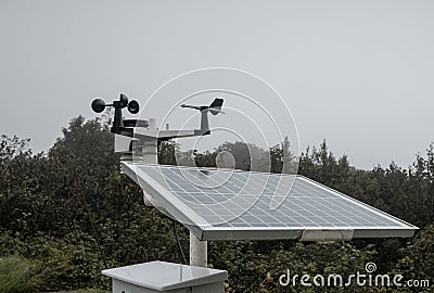 The Meteorological instrument to measure the wind speed, temperature and humidity and solar cell system on peak of Inthanon Stock Photo