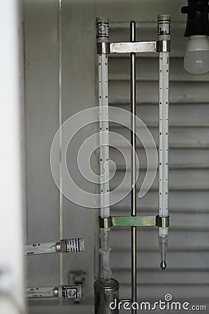 A meteorological thermometer consisting of a maximum and minimum thermometer is placed in a meteorological cage. This tool is used Stock Photo